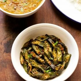 bhindi fry served in a white bowl.