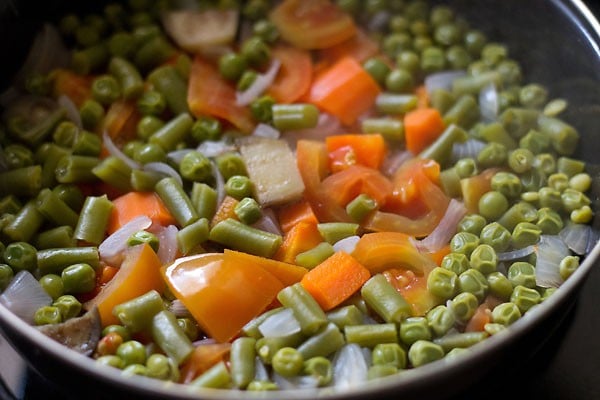 cooking vegetables for bisi bele bath recipe. 