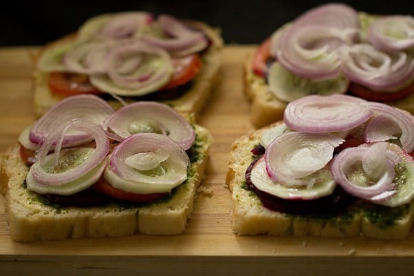 onion slices placed on the open sandwiches.