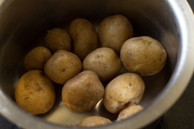 drained cooked potatoes for dum aloo recipe. 
