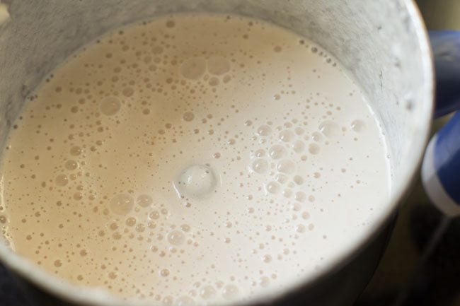 curd blended with ground paste for dum aloo recipe. 