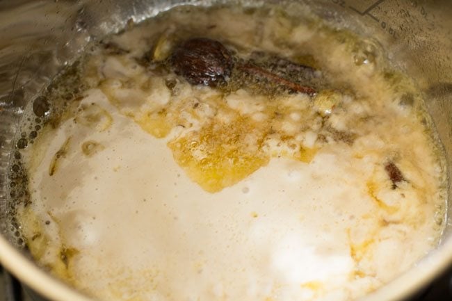 prepared paste added to pan for dum aloo recipe. 