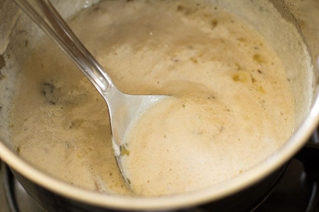 paste mixed with the ghee in pan for dum aloo recipe. 