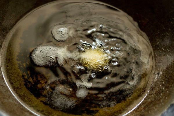 testing a tiny piece of ground mixture in hot oil.