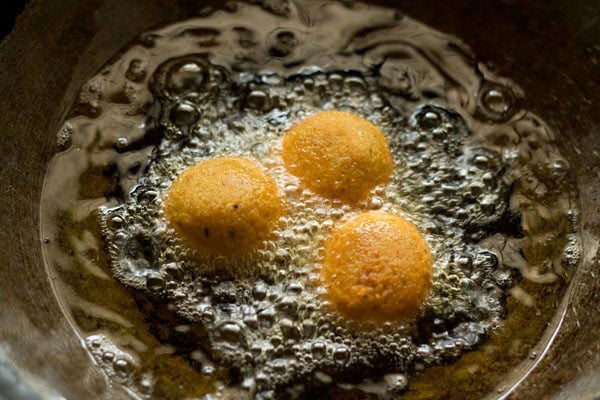 falafel being deep fried.
