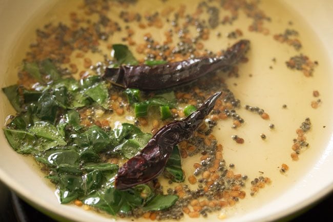 curry leaves, greeen chillies, red chillies added to pan