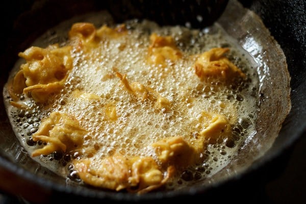 frying onion pakoda in hot oil. 