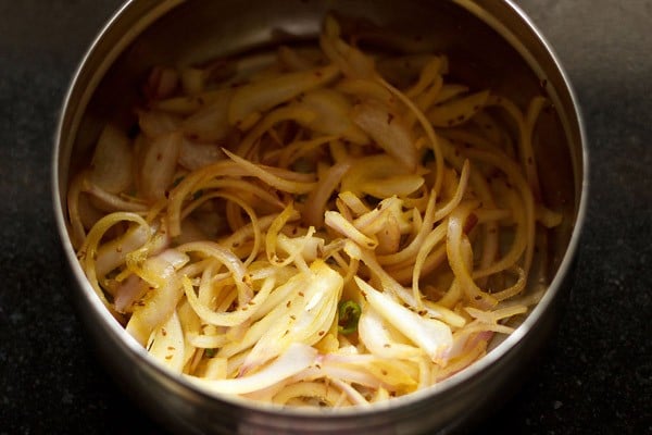 spiced onion mixture releasing water. 