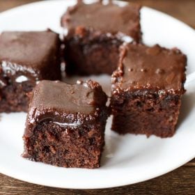 pieces of pressure cooker chocolate cake served on a white plate.