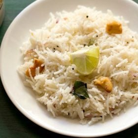 Shavige Bath served on a white plate with a small cubed lemon in the center.