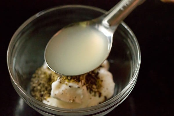 lemon juice being added with a spoon